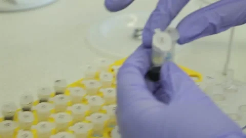 Scientist working in the laboratory with DNA and blood Stock Footage 136400841