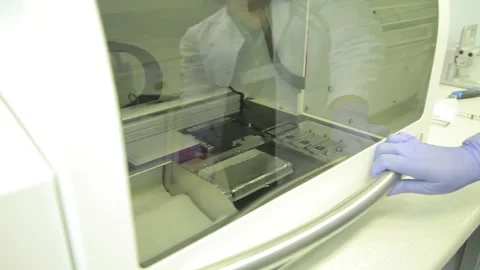 Scientist working in the laboratory with DNA and blood Stock Footage 136401084