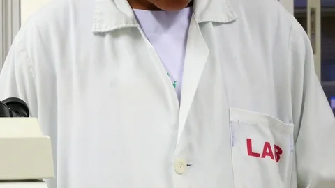 Scientist working in laboratory Stock Footage 79632802