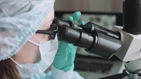 Scientist working in laboratory with microscope 스톡 동영상 72839008