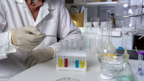 Scientist working with laboratory samples of nutritional supplements and maki Stock Photos