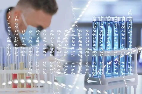 Scientist working in laboratory, test tubes with reagent and periodic table.. 库存照片