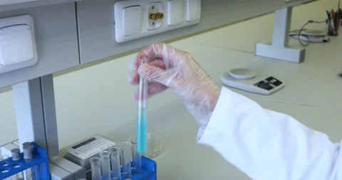 Scientist working in laboratory with tubes Video stock 136135379