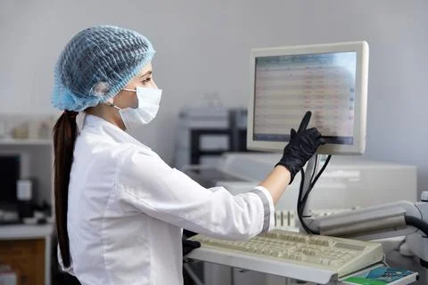 Scientist Working in Laboratory Using computer Screen Stock Photos