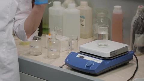 Scientist Working with Laboratory Weighing Scale Stock Footage 303762626