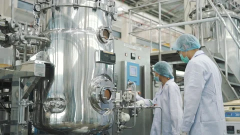 Scientist working with large incubator machine medium wide shot Video stock 158916369
