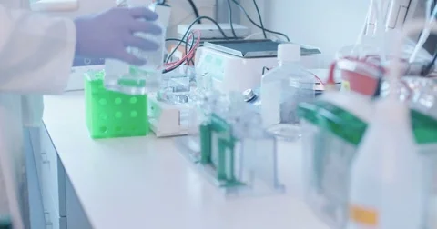 Scientist working in a medical laboratory conducting experiments Stock Footage 80676331