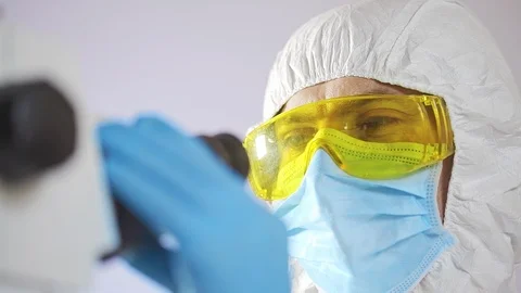Scientist working with microscope Stock Footage 106264360