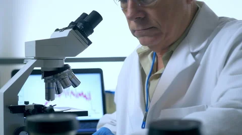 Scientist working with a microscope in laboratory 4k 스톡 동영상 58693487