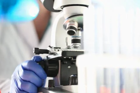 Scientist working with modern microscope in laboratory Stock Photos