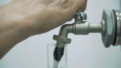 Scientist Working With Pharmaceutical Cbd Oil In A Laboratory Filling Measuring Stock Footage 116610856
