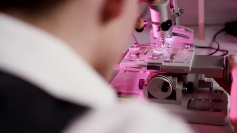 Scientist Working At Precision Instrument, Pink Lit Laboratory, Close Up Stock-Footage 341521498