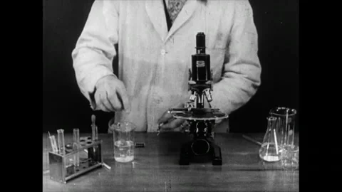 Scientist working in Science Lab with Microscope Archival  1945 Stock Footage 287343845