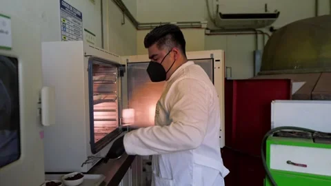 Scientist Working with Soil Samples in Lab Autoclave for Regenerative Stock Footage 346623033