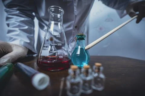 Scientist working with test tubes and colorful liquids in laboratory Stock Photos