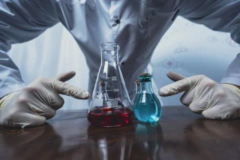 Scientist working with test tubes and colorful liquids in laboratory Stock Photos