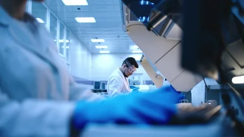 A scientist works with high-tech equipment in a modern laboratory Stock Footage 302482634