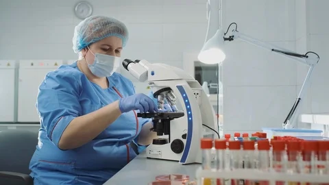 Scientist Works With Microscope. Vídeos de archivo 120197022