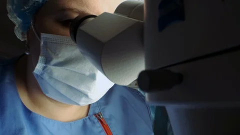 Scientist Works With Microscope. Stockbeeldmateriaal 120197669