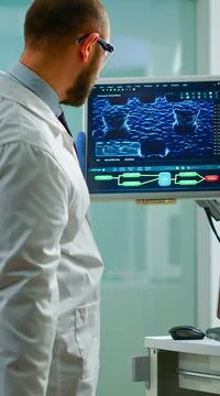 Scientist worried about virus evolution analysing DNA scan image Stock Photos