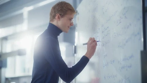 Scientist Write Formulas And Solving Problems Stock Footage 189870096