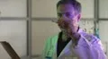 scientist writing on a clear board HD Footage