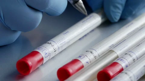 Scientist writing details on DNA sample Stock Footage 49755728