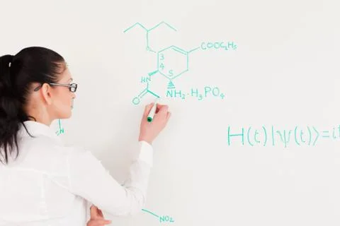 Scientist writing a formula 写真素材