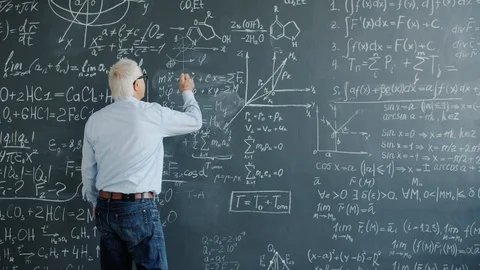 Scientist writing formulas on chalkboard underlining equation teaching science Stock Footage 124869661