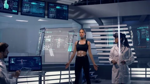 Scientists Analyze Athlete Diagnosis Data on Transparent Tablets Vídeo Stock 121341444