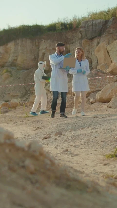 Scientists are collaborating on experiments at an outdoor research site to Stock Footage 314207519