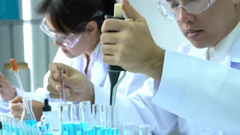 Scientists are experimenting with chemicals compound and absorb liquid the test Video stock 106871337