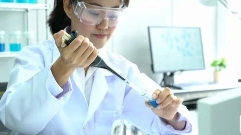 Scientists are experimenting with chemicals compound and absorb liquid the test Video stock 106876804
