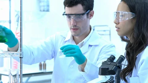 Scientists are experimenting with chemicals compound and liquid the test tube. Stock Footage 109135982