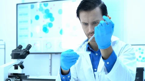 Scientists are experimenting with chemicals compound and absorb liquid Stock Footage 111665473