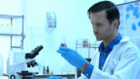 Scientists are experimenting with chemicals compound and absorb liquid Stock Footage 111667478