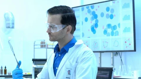 Scientists are experimenting with chemicals compound and absorb liquid Stock Footage 111667534