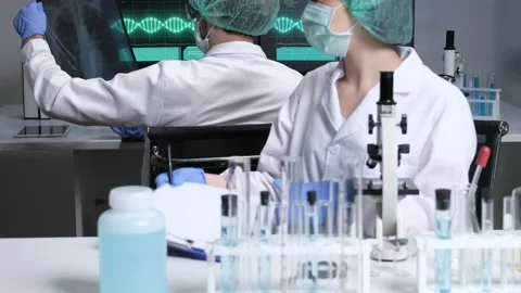 Scientists are researching for Covid19 vaccine in a laboratory. Stock Footage