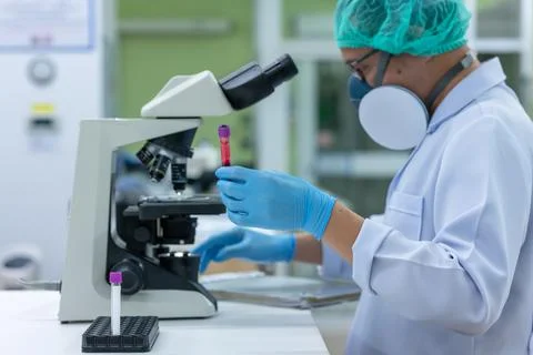 Scientists are studying research on the germs that cause COVID-19, the main c Stock Photos