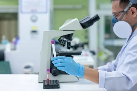 Scientists are studying research on the germs that cause COVID-19, the main c Stock Photos