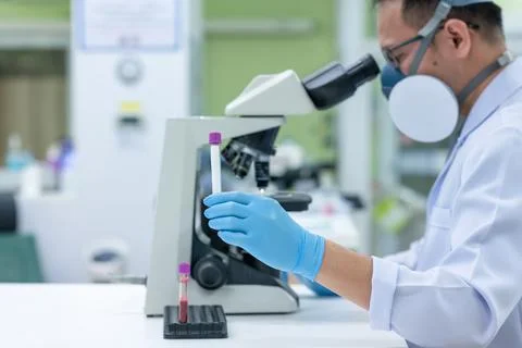 Scientists are studying research on the germs that cause COVID-19, the main c Stock Photos