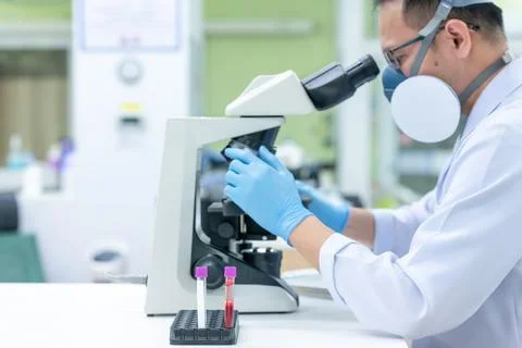 Scientists are studying research on the germs that cause COVID-19, the main c Stock Photos