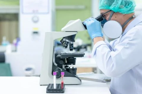 Scientists are studying research on the germs that cause COVID-19, the main c Stock Photos