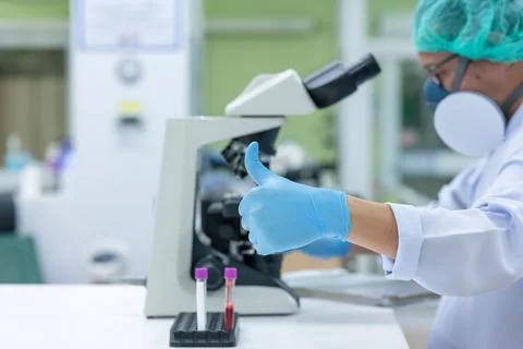 Scientists are studying research on the germs that cause COVID-19, the main c Stock Photos