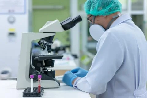 Scientists are studying research on the germs that cause COVID-19, the main c Stock Photos