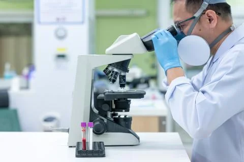 Scientists are studying research on the germs that cause COVID-19, the main c Stock Photos