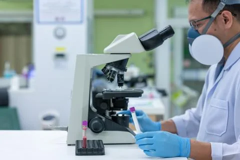 Scientists are studying research on the germs that cause COVID-19, the main c Stock Photos