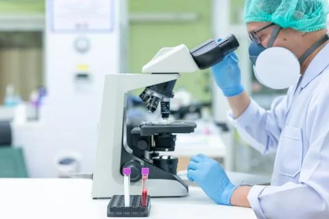 Scientists are studying research on the germs that cause COVID-19, the main c Stock Photos