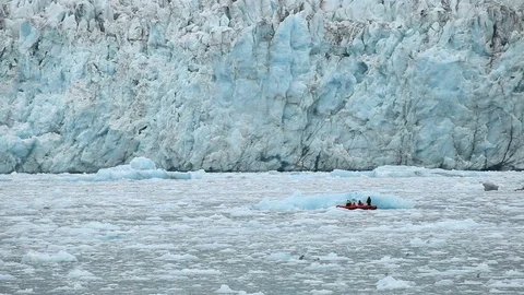Scientists on boat by glacier, Arctic Video stock 105229273