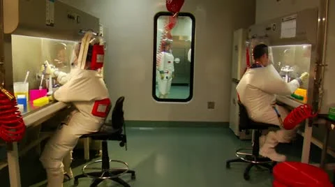 Scientists in bubble suit work in laboratory 스톡 동영상 21533329